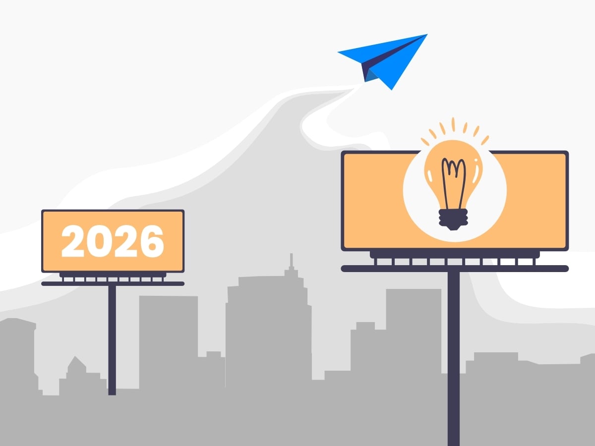 Billboard with lightbulb and a billboard that says 2026 with a blue paper airplane flying between them