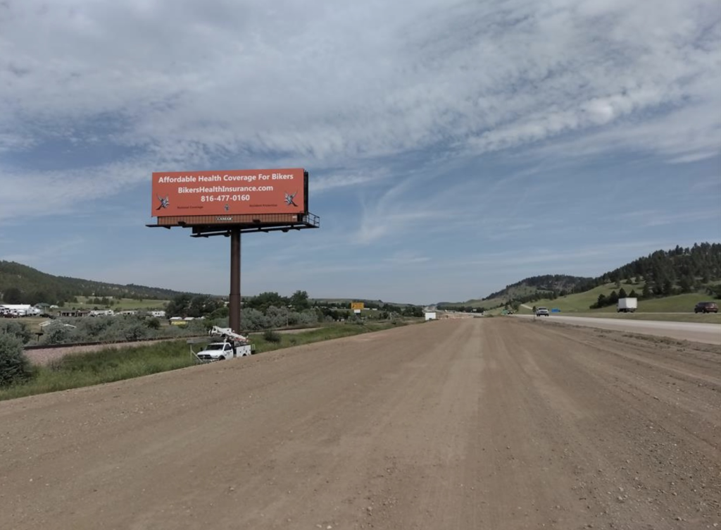 Niche-focused outdoor ads, such as this health insurance billboard tailored to bikers, show how targeted messaging can increase insurance sales. Reaching the right audience with a clear, relevant offer helps insurers stand out and drive more qualified leads.