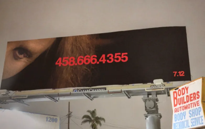 This picture is of a movie billboard campaign for the movie Longlegs that features a cryptic image of an eye and phone number.
