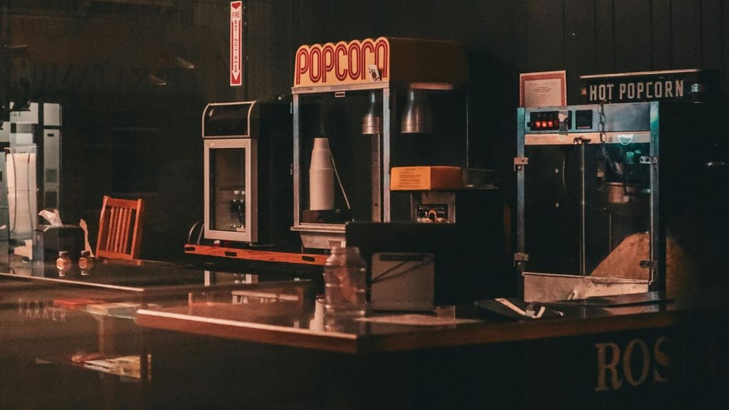A picture depicting renting billboards for movies with an image of the concession stand of a movie theater.