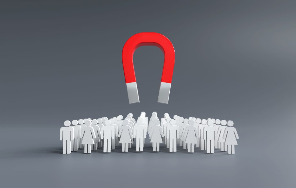 Cross media campaign strategy illustration showing a magnet attracting customers across multiple audience segments to increase brand engagement and lead generation.